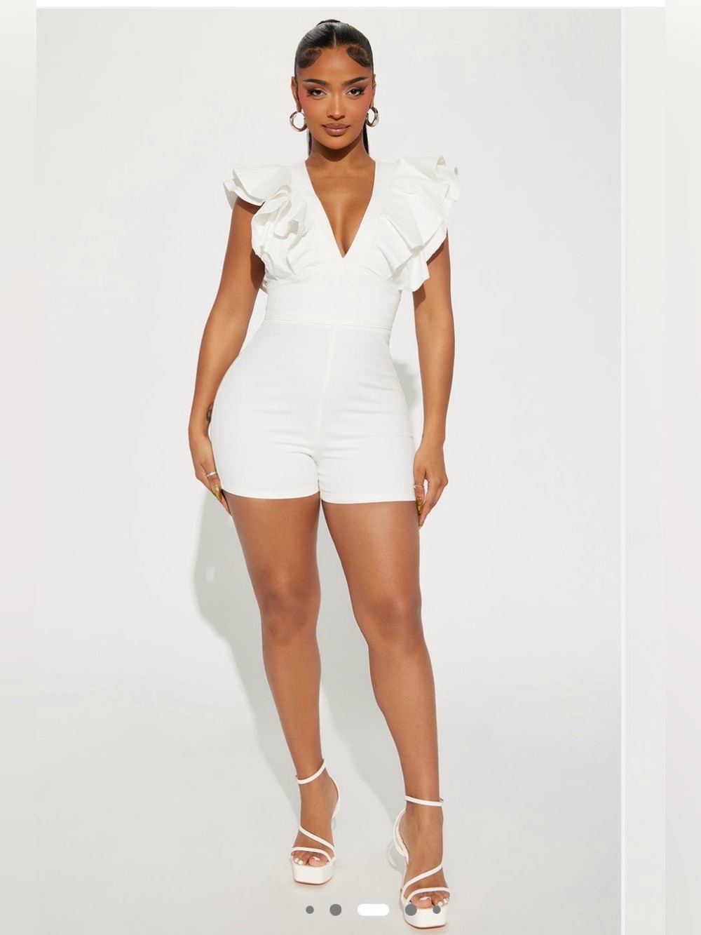 Fashion Nova NWT White denim romper. Length 31 inches. Pit to pit 17 inches. Bac